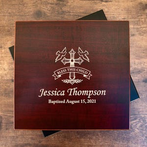 May include: A rustic wooden sign with the text "Welcome to our home" in white lettering. The sign features a distressed finish and a simple, inviting design, perfect for a front porch or entryway.