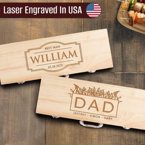 May include: Two wooden boxes with metal handles. One box is engraved with "BEST MAN" and "WILLIAM" with the date "03.28.2025". The other box is engraved with "DAD" and the names JEFFREY, SIMON, and GARY. The text "Laser Engraved In USA" is at the top.