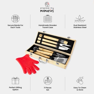 May include: An 11-piece grilling set with wooden handles and stainless steel tools, packaged in a wooden carrying case with a handle. The set includes a spatula, tongs, fork, knife, and cleaning brush. The case has a label that says "engrave my memories".