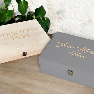 Customizable wooden memory boxes in natural and gray finishes, perfect for personal or business use. Add your logo or message for a unique, engraved keepsake box ideal for storing cherished items or presenting as a thoughtful gift.