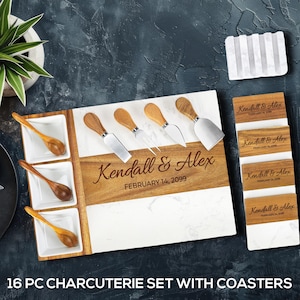 May include: A 16-piece charcuterie set with coasters. The set includes a wooden and marble serving board with cheese knives, small spoons, and coasters. The board is engraved with "Kendall & Alex" and "February 14, 2099".