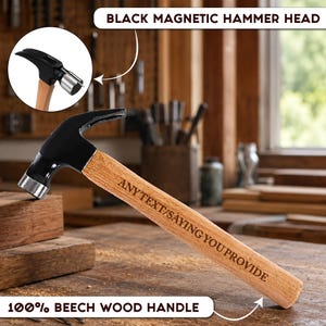 May include: A hammer with a black magnetic head and a light brown beech wood handle. The handle features the engraved text ANY TEXT/SAYING YOU PROVIDE. A circular inset shows the hammer head from a different angle with a nail in the magnetic slot.