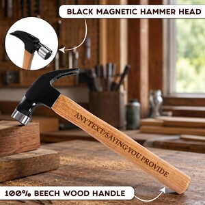 May include: A claw hammer with a black magnetic head and a light brown beech wood handle. The handle features the engraved text ANY TEXT/SAYING YOU PROVIDE. The tool includes a circular inset showing the magnetic head detail and text labels.
