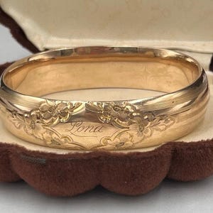 May include: A set of three ceramic mugs with a speckled, matte finish. The mugs are in shades of cream, light gray, and dark gray. Each mug has a simple, minimalist design, perfect for coffee or tea.