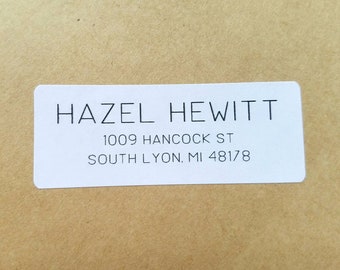 May include: White mailing label with black text. The text reads "HAZEL HEWITT", "1009 HANCOCK ST", and "SOUTH LYON, MI 48178".