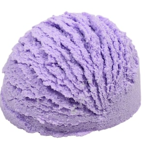 May include: A single scoop of lavender ice cream. The ice cream is a light purple color and has a soft, creamy texture.