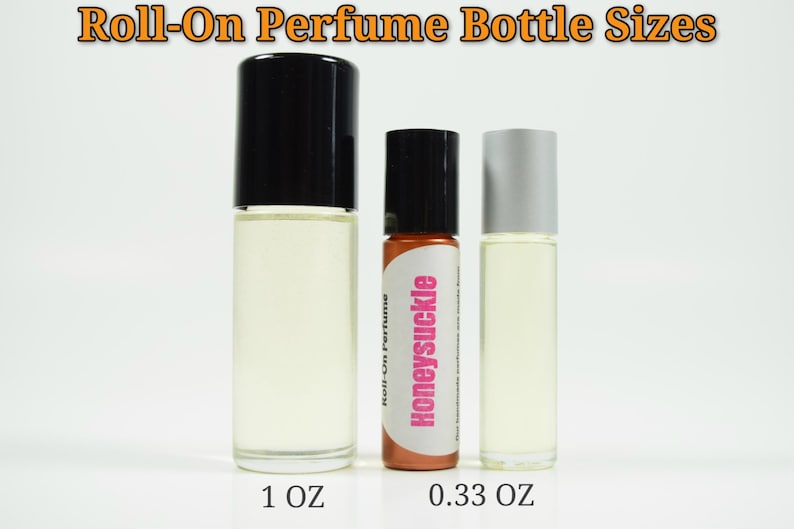 May include: Three roll-on perfume bottles, one 1 oz bottle with a black cap, one 0.33 oz bottle with a black cap and a brown label that says "Honeysuckle", and one 0.33 oz bottle with a silver cap.