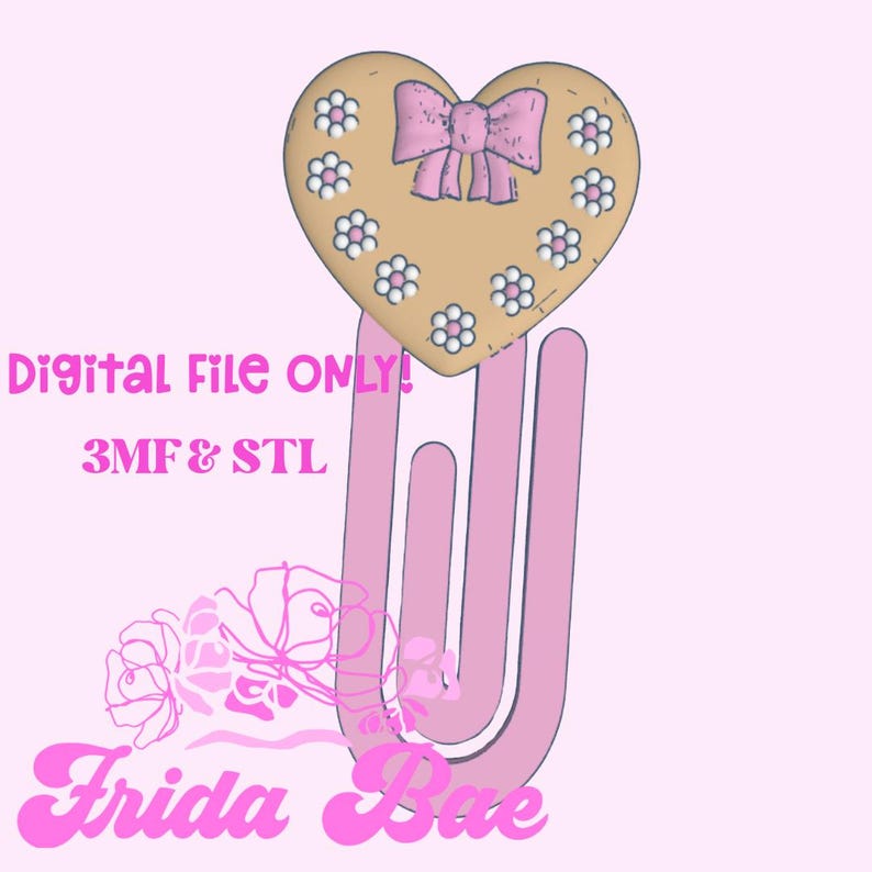 May include: A pink paperclip design with a heart-shaped top. The heart is tan with a pink bow and white and pink flower accents. Text on the image reads "Digital File ONLY! 3MF & STL" and "Frida Bae".