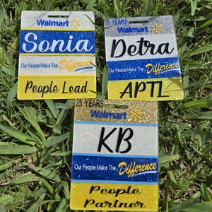 May include: Three custom Walmart name badges with glitter accents. The badges feature names "Sonia", "Detra", and "KB", along with the Walmart logo and text "Our People Make The Difference". The badges also display "People Lead" and "People Partner".