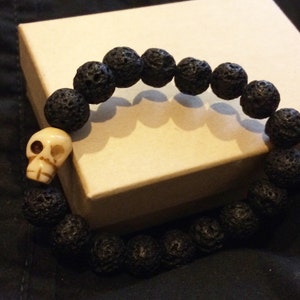 Black lava rock with bone skull bracelet