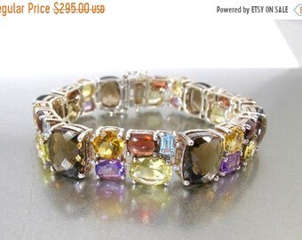 purple bracelet bag black box Authentic rose gold plated bracelet with sparkling rainbow marquise gems surrounding deep green and citrine