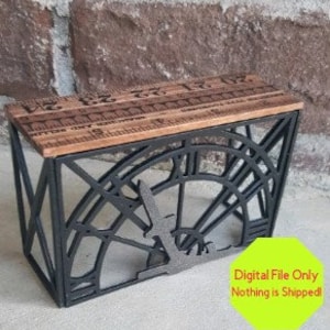 Puede incluir: Porta pañuelos de metal negro con un diseño de esfera de reloj y una tapa de madera. La esfera del reloj presenta un diseño de pájaro estilizado.