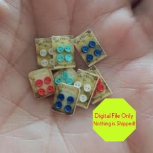 May include: Assortment of miniature button cards with various colors and designs. Each card features four buttons in a vintage style.