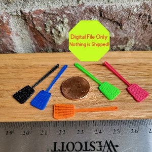 May include: Five miniature fly swatters in different colors: black, blue, green, orange, and red. The swatters are about the size of a US penny. The text "Digital File Only Nothing is Shipped!" is visible above the swatters.