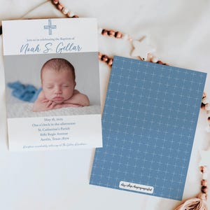 May include: A blue and white baptism announcement card with a photo of a baby boy. The card includes the baby's name, Noah S. Gellar, the date of the baptism, and the location of the ceremony. The card also features a small cross.