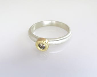 A modern handmade solitaire diamond ring in 18k yellow gold and sterling silver set with a chocolate-colored diamond Ready. Size 6.5