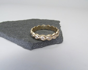 14K yellow gold diamond eternity ring set with white diamonds. Engagement ring, wedding ring, friendship ring. Size 6.5