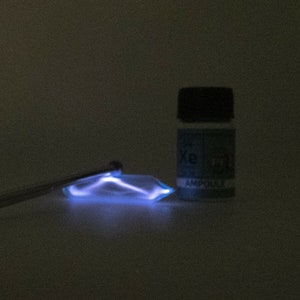 Pure Xenon Gas Ampoule Element Sample Low Pressure in Labeled Glass Bottle