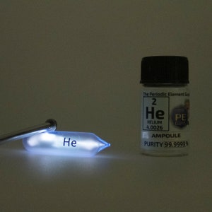 Pure Helium Gas Ampoule Element Sample Low Pressure in Labeled Glass Bottle