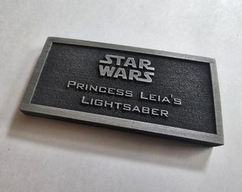 Princess Leia's lightsaber name plate placard