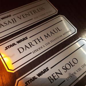 Lightsaber and episode name plate