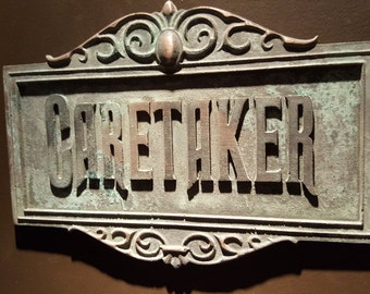Haunted Mansion Attraction Caretaker Plaque Sign antique finish
