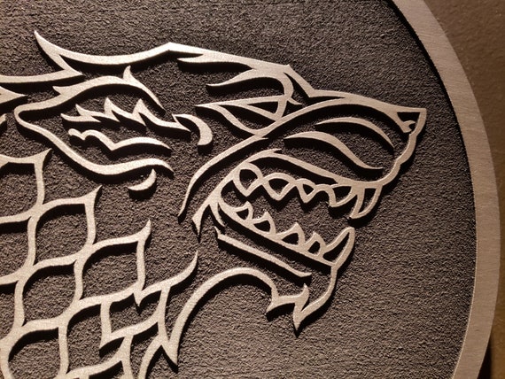 Detailed depiction of house stark's direwolf sigil on a shield
