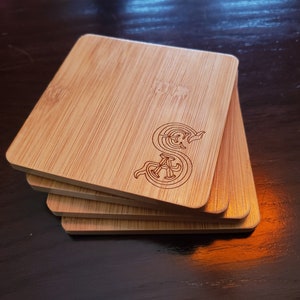 set of 4 society of explorers and adventurers themed bamboo coasters