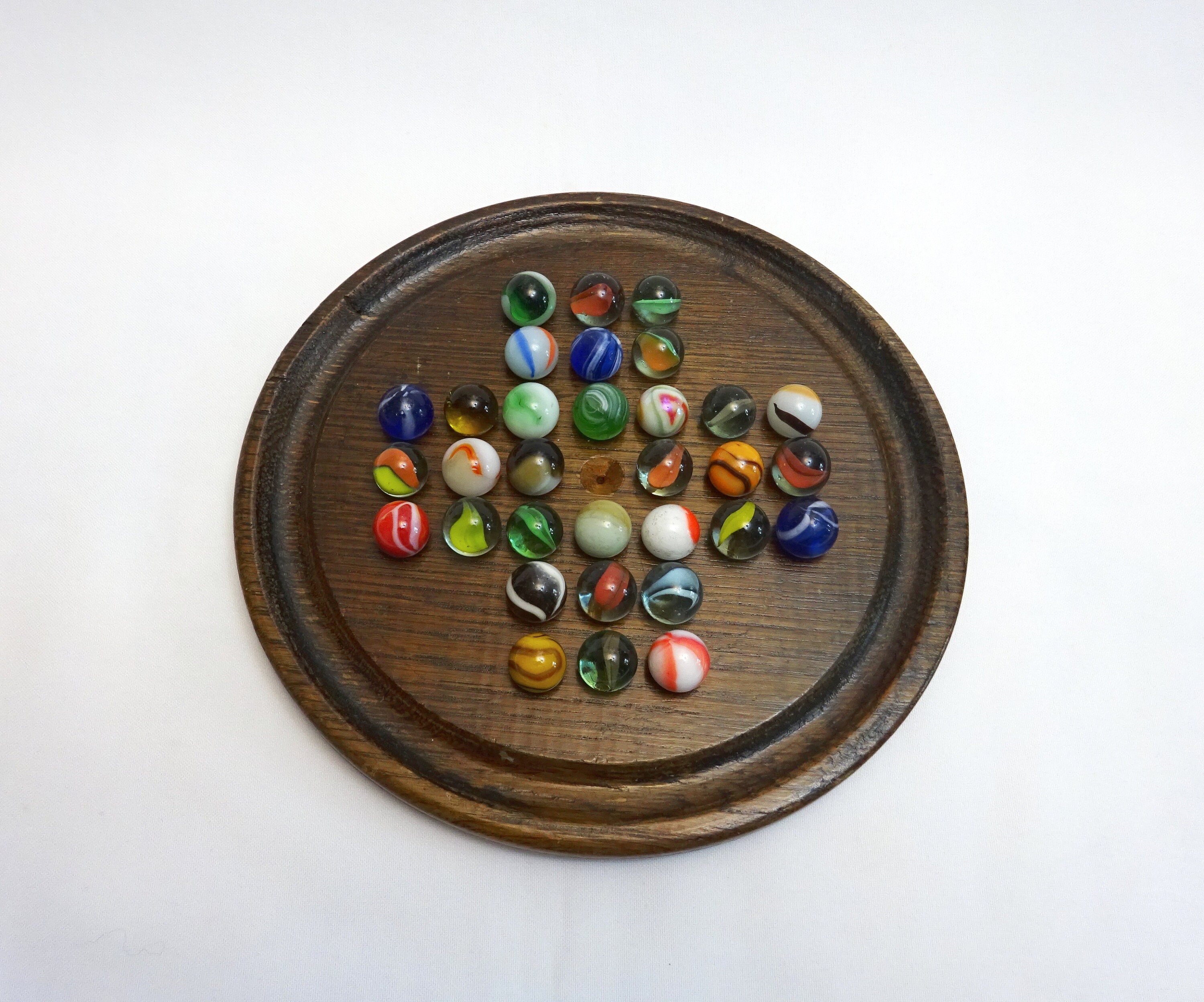 WE Games Solid Wood Solitaire with Blue Glass Marbles - 9 in. Diameter