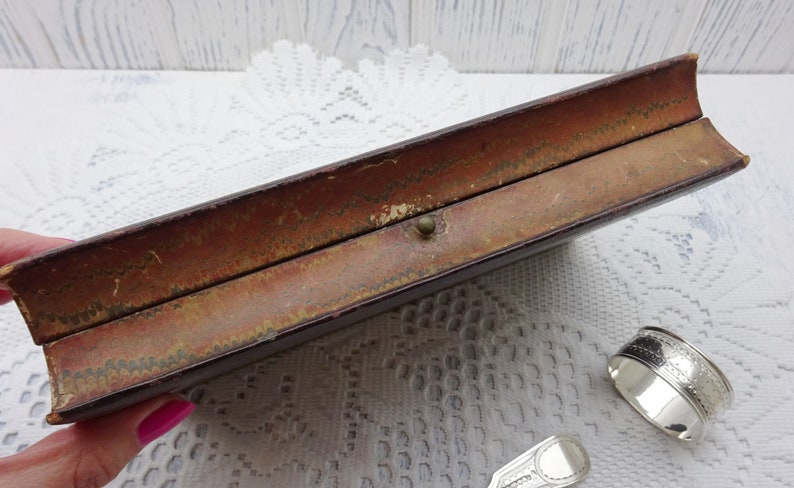 Victorian silver plated dessert cutlery book-shaped tooled leather box Engraved silver plate spoon napkin ring Parkin and Marshall. fork