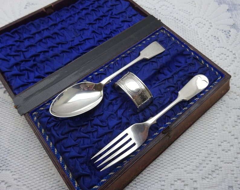 Victorian silver plated dessert cutlery book-shaped tooled leather box Engraved silver plate spoon napkin ring Parkin and Marshall. fork