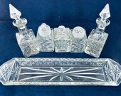 A Czech glass cruet condiment set, with oil and vinegar bottles, salt and pepper shakers and a mustard pot on a matching tray. c1930.
