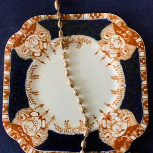 An antique tea plate in cobalt blue, terracotta and gold. Royal Vale c1930.