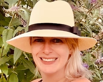 An original vintage English Olney Classic Panama Hat with black ribbon band and bow. Perfect for lazy summer days. UK hat size 6 3/4.
