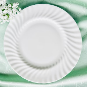 A Royal Doulton white swirl dinner plate. Excellent with vintage and contemporary china.