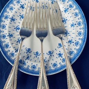 Three beautiful antique Art Nouveau epns dessert forks. Made by Jonathan Bell & Sons in 1897.