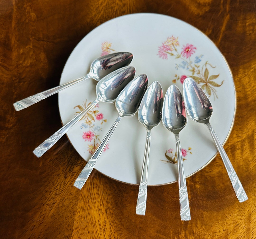 A Lovely Set of Six Viners silver Rose Silver Plated Grapefruit Spoons