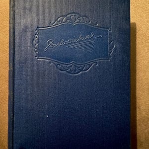 An antique copy of Nicholas Nickleby by Charles Dickens, gilt embossed. Published Hazell, Watson and Viney Ltd. Illustated by Phiz. c1930.