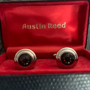 A pair of vintage cuff links with working compasses. The perfect gift for that special man in your life!