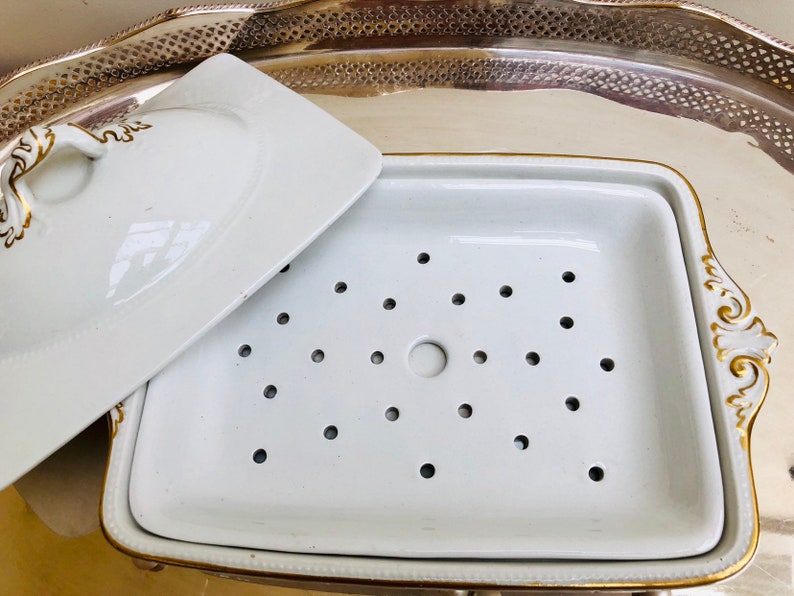 An elegant French white and gold lidded vegetable dish with an internal pierced dish c early 1900s. probably for asparagus