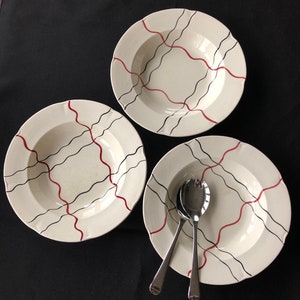 Three vintage studio pottery dishes, hand painted with red and black wavy lines. Very collectible. c1950s.