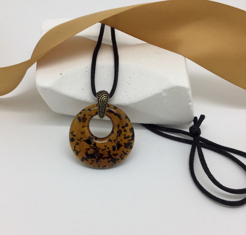 Amber And Black Glass Donut Pendant Faux Tortoise S Image 0