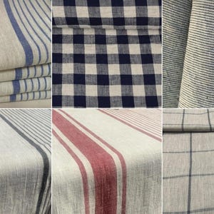 May include: A collection of ten fabric swatches featuring various patterns including blue and white stripes, navy and white gingham checks, thin pinstripes, dark green stripes, red stripes, and grey grid patterns on a light beige or off-white textile base.