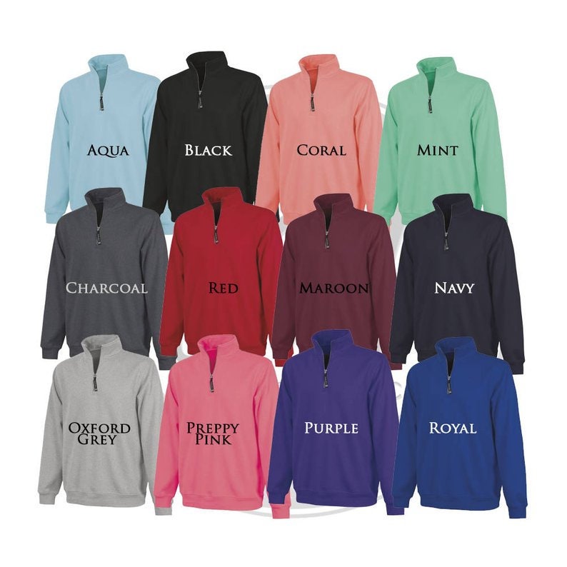 May include: Twelve different color sweatshirts with a quarter zip closure. The colors are aqua, black, coral, mint, charcoal, red, maroon, navy, oxford grey, preppy pink, purple, and royal.