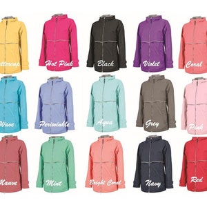 May include: A collage of 15 different colored rain jackets. The jackets are all the same style, with a zipper closure and a hood. The colors include buttercup, hot pink, black, violet, coral, wave, periwinkle, aqua, grey, pink, mauve, mint, bright coral, navy, and red.