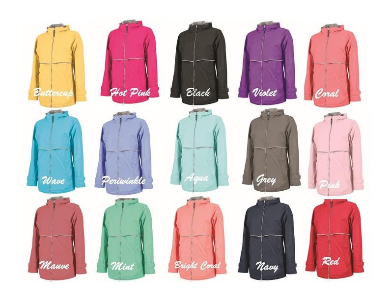 May include: A collage of 15 different colored rain jackets. The jackets are all the same style, with a zipper closure and a hood. The colors include buttercup, hot pink, black, violet, coral, wave, periwinkle, aqua, grey, pink, mauve, mint, bright coral, navy, and red.