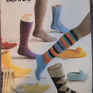 May include: A vintage advertisement featuring various knitted socks and slippers. The image showcases knee-high socks, argyle socks, and colorful striped socks. The text "ON YOUR TOES!" and "BERNAT" are visible.