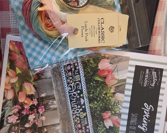 Stitching with the Housewives Sayings of the Seasons Spring  Feb 2024 Kit. Includes Chart, Fabric, Floss, Charm, Red Bag. FREE SHIPPING.
