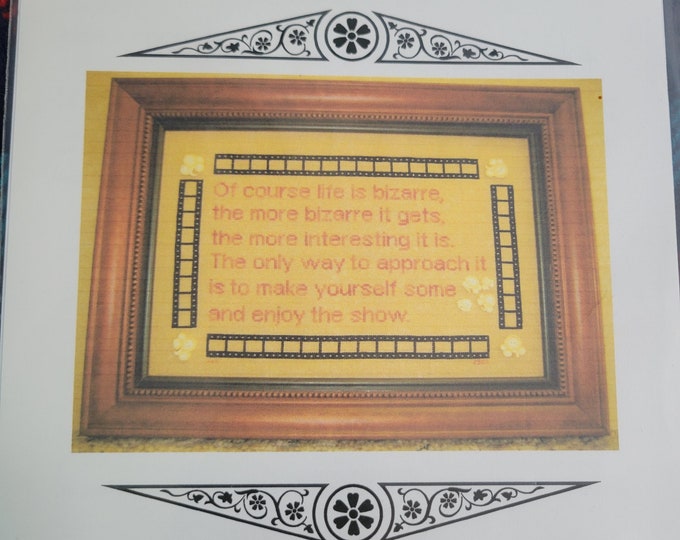 Enjoy The Show cross stitch pattern. Good Condition. Free Shipping. Great for movie rooms and home theater rooms!!
