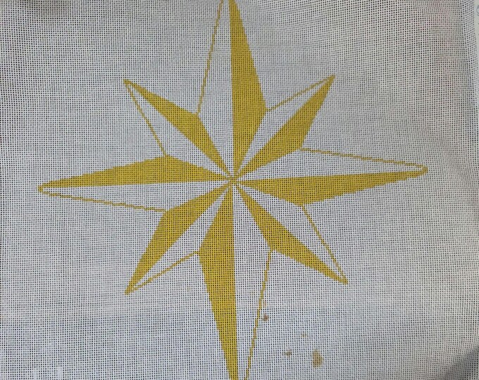 Gold Star Needlepoint Canvas 18# 11.5". Preowned Estate Sale Good Condition. Canvas was folded and note the paint near bottom of star.